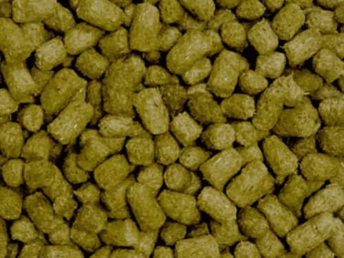 Billede af små foderpellets til gnavere, ideelle til marsvin, kaniner og hamstere, der sikrer en sund kost og optimale næringsstoffer.